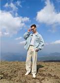 A person standing on a hillAI-generated content may be incorrect.